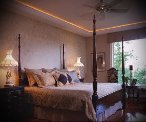 Bedroom with Four Poster Bed and Wood Floors