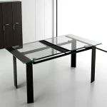 foldable_dining_table_with_a_sleek_glass_top_in_a__KGHGI5Q3