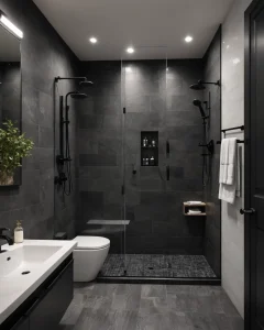 Ванная комната в стиле лофт, темные серые тона, душевая кабина со стеклянными стенами, черная сантехника, зеркало с подсветкой.